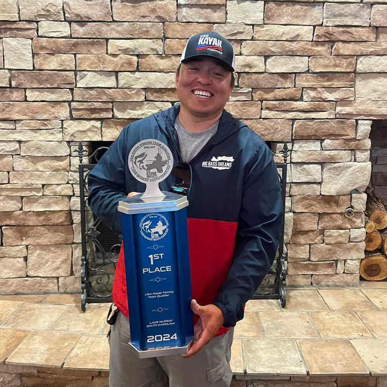 Anthony Garcia holding trophy