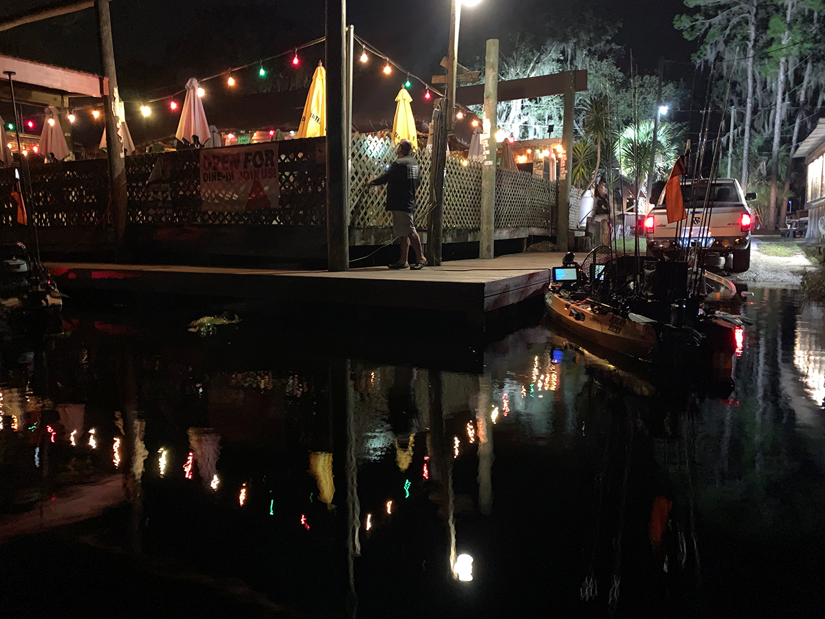 kayak angler launching in the dark