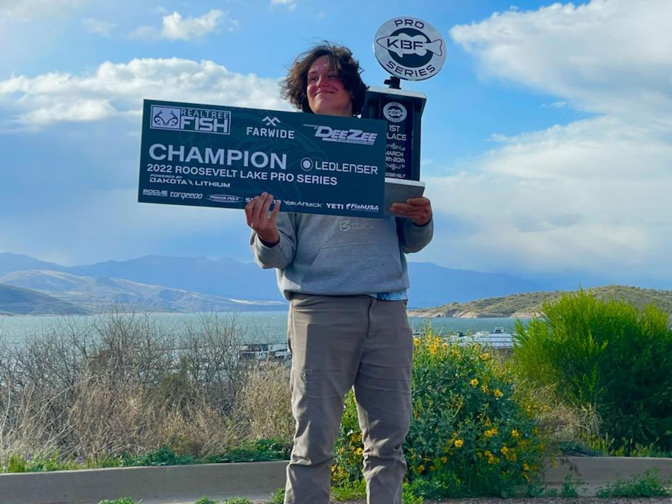 Quinlan Benavidez holding his Pro Series check and trophy